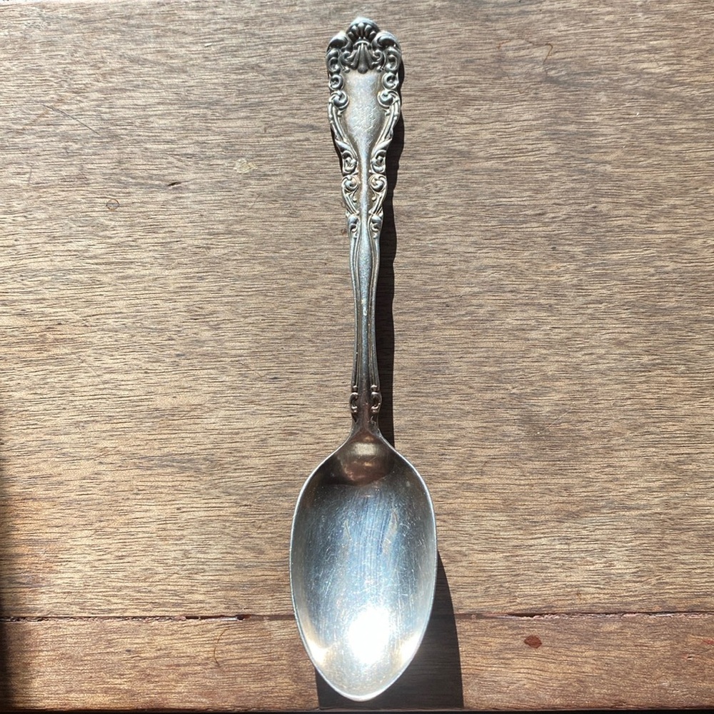 Monogrammed silver plate teaspoon.